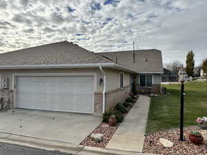 View of front facade with a garage and a front yard