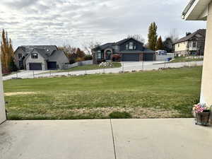 View of yard with a garage