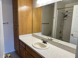 Full bathroom featuring toilet, tile patterned flooring, vanity, and tiled shower / bath