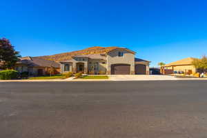 Mediterranean / spanish house featuring a mountain view and a garage