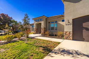 View of front facade with a garage and a front lawn