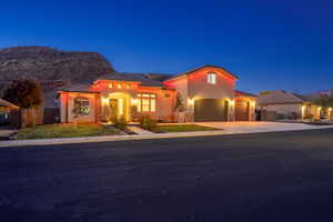 Mediterranean / spanish house with a mountain view, a garage, and solar panels