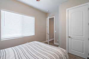 Bedroom featuring light carpet