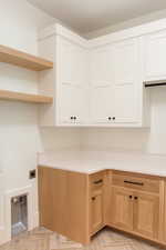 Laundry area with hookup for an electric dryer and cabinets