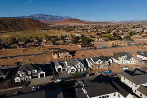 Birds eye view of property with a mountain view