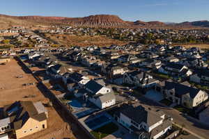 Birds eye view of property with a mountain view