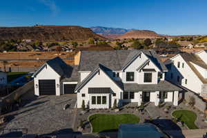 Modern inspired farmhouse featuring a mountain view and a garage