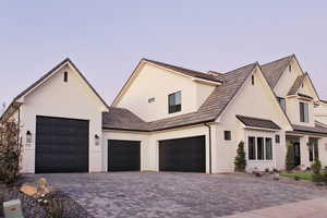 Modern farmhouse style home featuring a garage