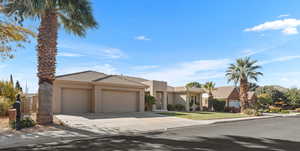 View of front of property featuring a garage