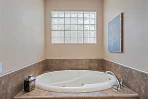 Bathroom with tiled bath