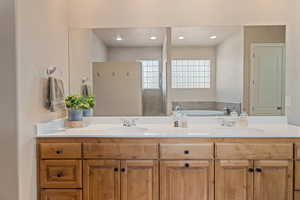 Bathroom featuring vanity and a bathtub