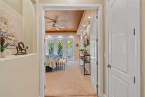 Interior space with carpet flooring and a tray ceiling