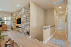 Hallway with light wood-type flooring