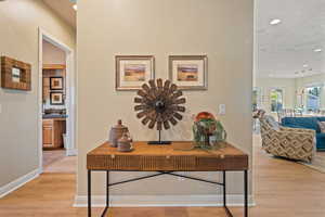 Office area featuring sink and light hardwood / wood-style floors