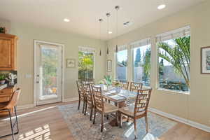 Dining room with light hardwood / wood-style flooring