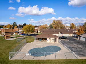 View of pool with a lawn