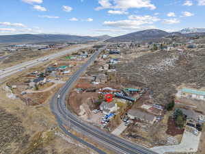 Birds eye view of property with a mountain view