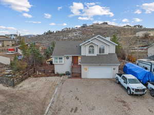 Split level home featuring a garage