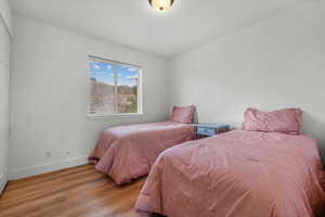 Bedroom with light hardwood / wood-style flooring