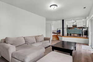 Living room with light wood-type flooring