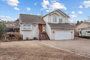 View of front of property with a garage