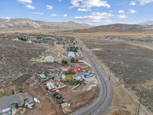 Birds eye view of property with a mountain view