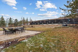 View of yard with a patio area and a trampoline