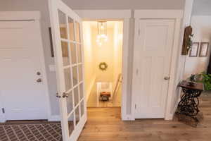 Foyer entrance with light hardwood / wood-style floors