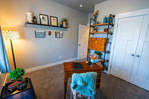 Office with dark colored carpet