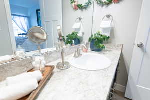 Bathroom with wood-type flooring and vanity