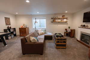 Living room with dark colored carpet