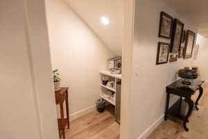 Hallway featuring light wood-type flooring