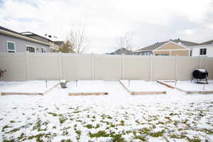 View of yard layered in snow