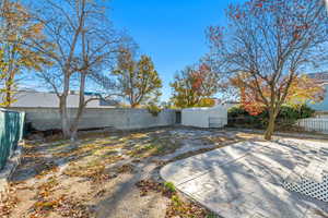 Back yard with stamped concrete patio.