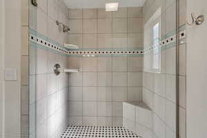 Tile shower in primary bathroom