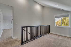 upstairs loft area, with view into upstairs family room