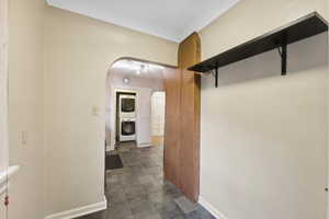 Hallway with stacked washer / dryer