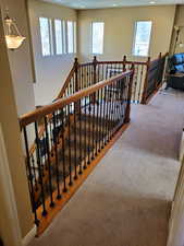 Stairway featuring carpet flooring