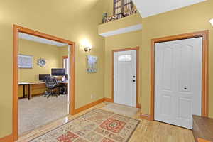 Entrance foyer featuring light hardwood / wood-style flooring