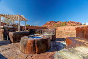 View of yard with a pergola and a mountain view