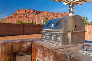 View of patio featuring a mountain view and grilling area