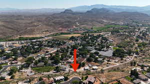 Birds eye view of property with a mountain view