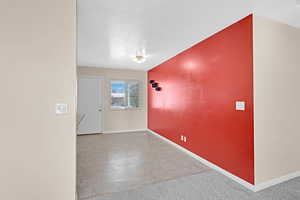 Empty room featuring a textured ceiling