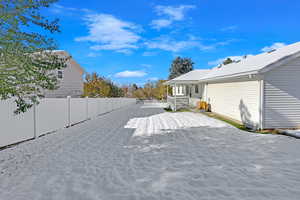 View of yard with covered porch