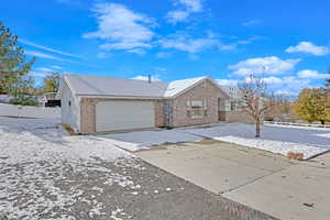 View of front of property featuring a garage