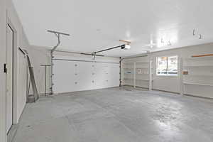 Garage featuring a garage door opener