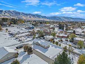 Snowy aerial view featuring a mountain view