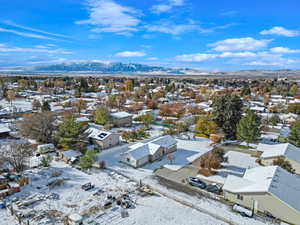 Snowy aerial view with a mountain view