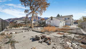 Exterior space with a mountain view and a garage