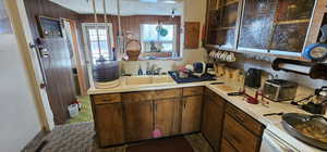 Kitchen with decorative light fixtures and sink